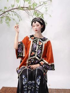 A Magua 马褂, or "rider's jacket", is an intricately embroidered round collar jacket with a wide black trim. Adorable goldfish and lively wisterias adorn the trim, all along the hem, cuffs, and collar. Comfortable and loose, this jacket can be layered over other Qing Dynasty standing collar tops, or worn as-is. Pair with your favorite Qing Mamian skirt 清马面裙 or with the matching lounge pants! Lounge pants feature an embroidered cuff around the ankles to tie in with the jacket, elasticized waist, an Embroidered Long Sleeve Outerwear For Costume, Traditional Red Costume Outerwear, Mamian Skirt, Pond Ripples, Hanfu Men, Modern Hanfu, Riders Jacket, Standing Collar, New Chinese Style