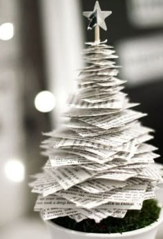 a christmas tree made out of newspaper is shown on the instagram page, and it appears to be fake