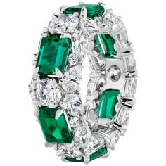 Designed as a 3 Row Bombay Shaped Ring, where you can see the different shaped stones from all angles. The Ring's main centerpiece is in the 6 fine Emeralds, each spaced out with 1 Round Diamond to highlight each Emeralds individual and intense beauty, with Pear and Round shaped diamonds on the border lines so as to make the Emeralds look as if a crown is holding them up. 6 Emeralds weighing approximately 6.03 Carats. 42 Diamonds weighing approximately 5.82 Carats. Finger Size 5. Can be made to Border Lines, On The Border, Contemporary Ring, Modern Ring, Cluster Ring, Modern Jewelry, Round Diamond, Round Diamonds, The Row