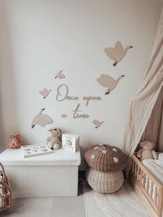 a baby's room with white walls and decorations