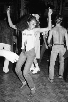 black and white photograph of people dancing on the dance floor