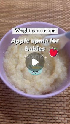 a bowl filled with oatmeal sitting on top of a table next to a spoon