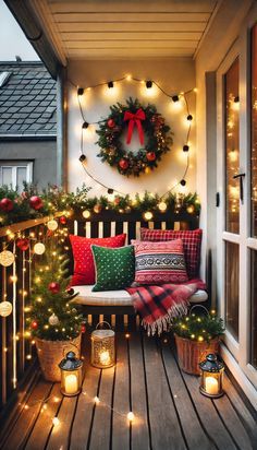 a porch decorated with christmas lights and wreaths