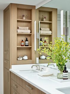 the bathroom is clean and ready to be used as a storage area for personal care items