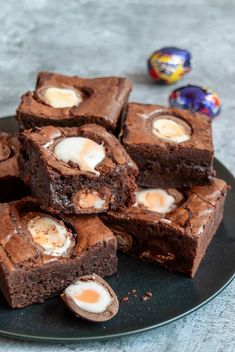 several brownies on a plate with eggs in them