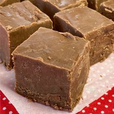 several pieces of brownie sitting on top of a table