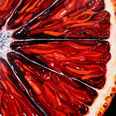 an orange slice with red and white paint on it