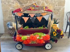 Halloween wagon decorated to look like a pumpkin patch. Pumpkin Patch Trick Or Trunk, Pumpkin Patch Halloween Costume, Pumpkin Patch Wagon Costume, Pumpkin Patch Stroller Costume, Pumpkin Patch Costume, Family Costume With Wagon, Pumpkin Wagon, Wagon Costume Ideas, Wagon Halloween Costumes