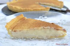 a piece of pie sitting on top of a glass plate