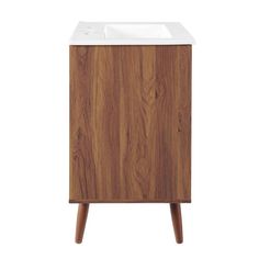 a wooden cabinet with a white sink on it's side and two wood legs