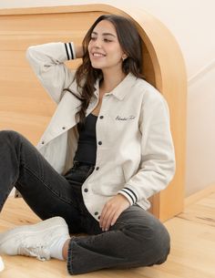 Build up your layers with our God of Miracles Ivory Bomber Jacket - the perfect medium-weight, corduroy statement piece that can be effortlessly worn over our hoodies or tees.      Size: Model is 5'8" and wearing a size Small. Fit: Relaxed, Unisex Fit Color:  Ivory Composition:  100% Cotton Features:  Striped trim, Snap button closure, Flat collar, Front welt pockets, Embroidered details, Lined Trendy Outerwear With Corduroy Collar For Streetwear, Casual Winter White Outerwear With Ribbed Cuffs, Trendy Streetwear Outerwear With Corduroy Collar, Cotton Spring Outerwear For College, Trendy Fall Outerwear For Campus, Sporty Cream Cotton Outerwear, Trendy Fall Campus Outerwear, Trendy White Outerwear With Ribbed Cuffs, Cotton Outerwear For Fall Campus Wear