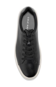 Smooth leather crafts a classic sport inspired low profile sneaker that features a luxuriously comfortable molded footbed that adds comfort to every step. Round toe Lace-up Cushioned insole Padded cuff White sole Leather upper, manmade sole Imported Classic Black Sneakers With Textured Sole, Black Leather Sneakers With Ortholite Insole, Comfortable Black Sneakers With Perforated Toe Box, Classic Everyday Sneakers With Cushioned Footbed, Casual Black Sneakers With Embossed Logo, Classic Low-top Sneakers For Everyday, Synthetic Sneakers With Plain Toe For Streetwear, Synthetic Plain Toe Sneakers For Streetwear, Synthetic Sneakers For Streetwear With Plain Toe