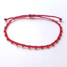 "♡Listing is for one dainty seed bead bracelet or anklet as featured and your choice of card♡ Perfect for everyday wear. Super dainty and minimalist look. Great way to add a little color to any outfit. Makes a very dainty stacking bracelet too. *Featured: Cord color Red & Red beads. *Material: Item is made with sturdy nylon cord. The cord resembles silk and color will not fade away. Tiny glass seed beads are carefully hand braided as the highlight of this item. *Closure Styles: All styles ha Minimalist Red Beaded Bracelet With Tiny Beads, Red Adjustable Friendship Bracelets With Tiny Beads, Adjustable Red Friendship Bracelets With Tiny Beads, Adjustable Red Anklet Bracelet, Adjustable Red Anklets With Round Beads, Red Adjustable Friendship Bracelets With Heart Beads, Adjustable Red Friendship Bracelets With Heart Beads, Red Bohemian Anklets As A Gift, Red Beaded Friendship Bracelets