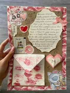 someone is holding up a handmade valentine's day card