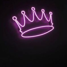 a purple neon sign with a crown on it