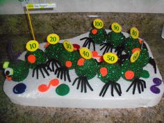 a cake decorated to look like the very hungry caterpillars