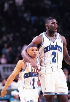 two basketball players standing next to each other