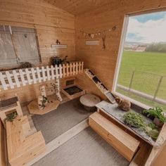 the inside of a small cabin with wooden walls