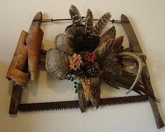 an arrangement of deer antlers and other items mounted on a wall