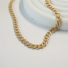 Elevate her style with our exquisite 7mm Miami Cuban Chain Necklace, crafted from luxurious 14K solid gold. Each piece is meticulously handcrafted, promising beauty and elegance that lasts a lifetime. Indulge in luxury with our Miami Cuban Chain Necklace, a symbol of strength and sophistication. The 7mm curb chain boasts a bold yet feminine design, perfect for making a statement wherever she goes. Whether it's a mama gift or a promise gift for your wife, this stunning piece is sure to captivate Curb Chain Necklace, Chain For Women, Miami Cuban, Mama Gifts, Solid Gold Jewelry, Feminine Design, Cuban Chain, Curb Chain, Gifts For Wife