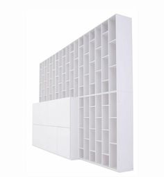 a white book shelf with several shelves on each side