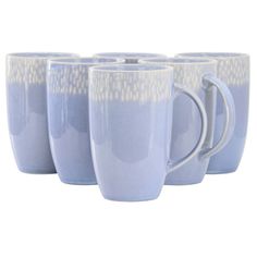 four blue coffee mugs sitting next to each other