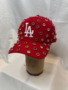 Rhinestone New Era SnapBack hat as seen on Chris brown during the 11:11 tour. Los Angeles dodgers hat. Made to order each stone is individually placed. Approx 16 different colored stones and approx 75 stones placed per hat. Each hat is unique and may differ from photos on listing.  if you're interested in a different color not listed or a different team it is subject to availability. Send me a message me for a custom order if available there will be a 3-5 days processing time. Bling Dodgers Hat, Custom Uggs, Custom New Era Hats, Socks And Jeans, Dodgers Hat, Fashionista Outfits, Streetwear Hats, Dodger Hats, Grey Hair Dye