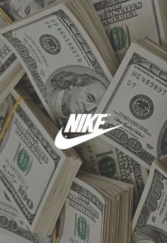 a pile of money with the word nike on it and a white nike logo over top