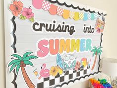 a bulletin board that says cruising into summer next to a lamp and some crayons