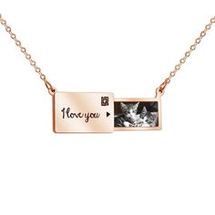 a gold plated necklace with an image of a cat and the words, i love you