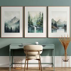 three paintings hang on the wall above a desk with a plant in front of it