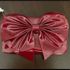 Nordstrom Red Bow Clutch Bag. Shiny Plastic Red Clutch Bag With Large Bow Detail. Has Some Small Scratches From Storage, But Is New With Tags. Red Crossbody Clutch For Party, Trendy Red Clutch For Parties, Trendy Red Party Clutch, Trendy Red Pouch Clutch, Brown Leather Work Bag, Red Clutch Bag, Taupe Bag, Black Mini Bag, Leather Work Bag