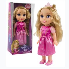 the doll is in its pink box and has a princess tiara on her head