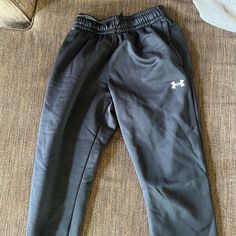 Black Under Armour Wide Leg Sweatpants With A White Under Armour Sign. These Are Super Comfy And Thick Warm Sweatpants. They Were Never Worn And Are In Perfect Condition. Under Armour Casual Loungewear Pants, Casual Under Armour Pants For Loungewear, Casual Under Armour Loungewear Pants, Under Armour Bottoms With Pockets, Black Casual Under Armour Sweatpants, Under Armour Black Sweatpants With Pockets, Under Armour Pants With Elastic Waistband, Under Armour Black Sweatpants For Sports, Black Sporty Sweatpants By Under Armour