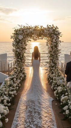 the bride is walking down the aisle at sunset