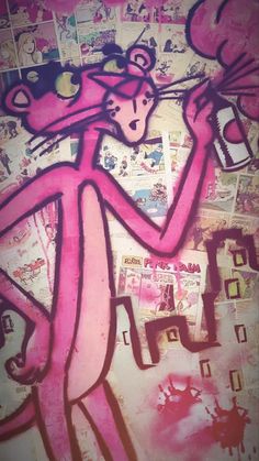 a drawing of a pink cat on a wall