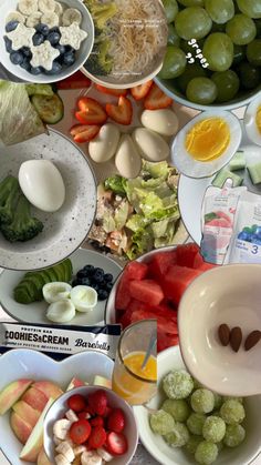 an assortment of fruits and vegetables in bowls