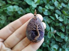 "Amethyst Tree Of Life Pendant - choose a unique gift for any occassion: Mothers Day, Fathers Day, Valentine's Day, Thanksgiving Day, Graduation, Copper Anniversary, Birthday, Christmas, New Year etc. This Tree Of Life Pendant is made of copper wire and natural Amethyst. The pendant is oxidized and polished. Any tarnishing that occurs naturally over time can be easily polished away with a silver polishing cloth. This Amethyst Pendant is made in a wire wrap technique. You will get it in a kraft b Purple Amulet Jewelry As A Gift, Purple Amulet Jewelry As Gift, Purple Amulet Style Jewelry Gift, Purple Amulet Necklaces As Gifts, Mystical Amethyst Crystal Necklace Gift, Mystical Amethyst Necklace For Gift, Handmade Lavender Crystal Necklaces Gift, Handmade Lavender Crystal Necklace Gift, Handmade Mystical Amethyst Crystal Necklace