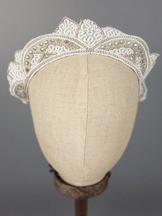 Original vintage lace and embellished Juliet cap perfect paired with silk gowns and cathedral veils. The lace on the cap has been restored.  Made In: 1920s Made of: lace, beads, rhinestones Color: silver, ivory, white Fastens: cap style Measures: one size fits most THIS IS A FINAL SALE ITEM Luxury Bead Cap Headpieces For Parties, Juliet Cap Veil, Silk Gowns, Juliet Cap, Cap Veil, Bridal Cap, Deco Beads, Crown Cap, Wedding Veil Accessories