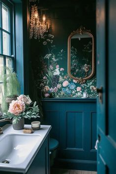 a bathroom with green walls and floral wallpaper