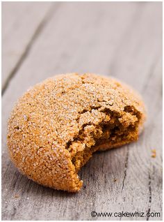 a close up of a cookie on a wooden surface