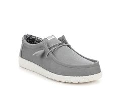 A breathable chambray-blend upper and lined with a soft, cotton lining for simple strides. Featuring an easy-on system with elastic laces, an ultralight outsole and a cushioned ankle collar for all-day comfort and wear. Breathable canvas upper with lightly padded collar, Easy slip-on entry with bungee cord laces, Round moc toe with stitching details, Cushioned Memory Foam insole with leather lining, Sculpted midsole and UltraLight outsole with Flex & Fold Technology, HEYDUDE branding details | M Gray Lace-up Canvas Shoes With Rubber Sole, Gray Canvas Shoes With Rubber Sole, Comfortable Gray Canvas Shoes With Rubber Sole, Gray Textile Slip-on Sneakers Casual, Gray Textile Slip-on Sneakers Casual Style, Casual Gray Textile Slip-on Sneakers, Cord Lace, Stitching Details, Bungee Cord