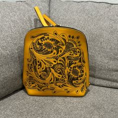 Yellow Tooled Leather Backpack Nwot Yellow Leather Standard Backpack, Yellow Rectangular Leather Backpack, Yellow Leather Rectangular Backpack, Yellow Travel Shoulder Bag Backpack, Yellow Leather Backpack For Daily Use, Gold Leather Backpack, Gold Backpack With Adjustable Strap, Gold Backpack For Everyday Use, Yellow Rectangular Leather Backpack For Everyday Use