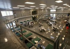 the inside of an office building with lots of desks