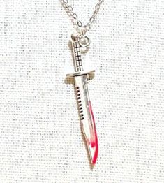 This fun necklace is "killer." It's 16 inches on a dainty stainless steel chain and is adjustable with a 3 inch extender and a lobster claw clasp and comes in a cute box. It can be made with red on the knife or none. Knife Necklace, Killin It, Cute Box, Memphis Tn, Cool Necklaces, Steel Chain, Stainless Steel Chain, Lobster Claw, Charm Necklace