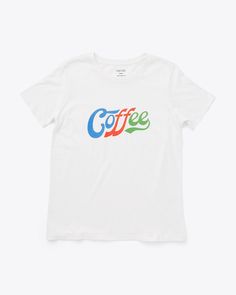 white tee with blue, red and green 'coffee' on the front Coffee Color Crew Neck T-shirt For Everyday, Organic Cotton Short Sleeve T-shirt With Letter Print, Coffee Color Short Sleeve T-shirt With Screen Print, Casual Coffee-colored Screen Print T-shirt, Organic Cotton Logo Print T-shirt With Short Sleeves, Organic Cotton Short Sleeve T-shirt With Logo, Organic Cotton Pre-shrunk T-shirt, Retro Text Print T-shirt For Everyday, Coffee Color Relaxed Fit Short Sleeve T-shirt