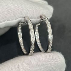 Treat yourself with the brilliant shine of moissanite! Environmentally friendly stones and fairly priced. These timeless hoop earrings will never go out of style. They are perfect for all occasions and suitable for men or women. Moissanite will last forever. They have a hardness level of 9.25 out of 10 while CZ is only 3-4 and diamonds are 10. They look visually identical to diamonds and even passes many handheld diamond testers. Get a $2000 high end look at a much lower price. Order yours today! 2.1 CTW Carat VVS1 Clarity E Color Moissanite Stones 925 Sterling Silver (Gold or rhodium finish) 30mm diameter, 3mm width Luxury Diamond White Hoop Earrings With Channel Set, Gift Channel Set Hoop Earrings, Diamond White Channel Set Diamond Earrings As Gift, Cubic Zirconia Channel Set Hoop Earrings As Gift, Channel Set Hoop Diamond Earrings For Anniversary, Gift Cubic Zirconia Hoop Earrings Channel Set, Silver Channel Set Hoop Earrings, Silver Hoop Earrings With Channel Set, White Channel Set Hoop Earrings