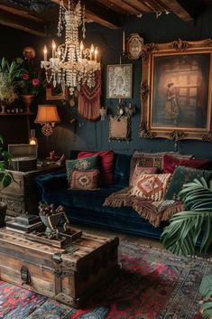 a living room filled with lots of furniture next to a chandelier hanging from the ceiling