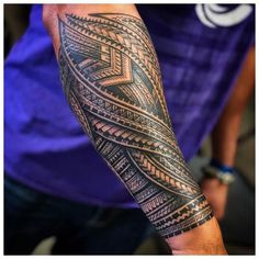 a man with a tattoo on his arm