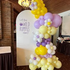 a bunch of balloons that are on top of a table